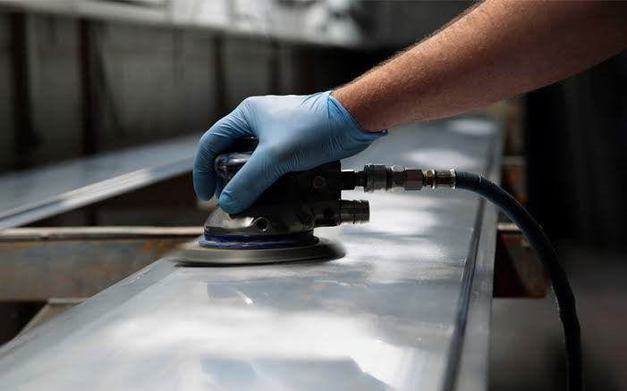 Polishing metal with sandpaper