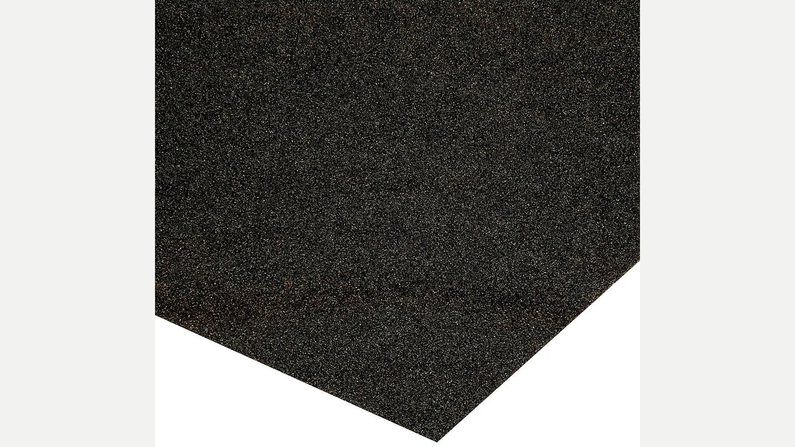 Close-up of the abrasive surface and corner of a dark sandpaper sheet.